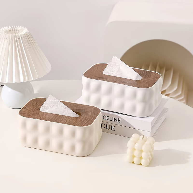 Modern white acrylic tissue box with spring-loaded lid and wood-grain finish.