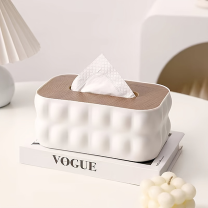 Modern white acrylic tissue box with spring-loaded lid and wood-grain finish.